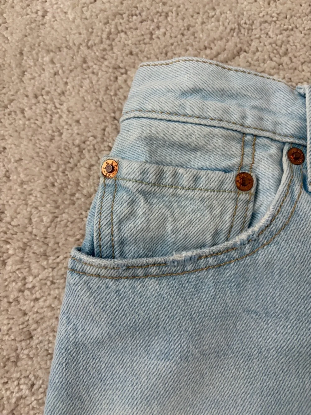 Levi's Light Blue Frayed Denim Cutoff Shorts - Picture 2 of 3